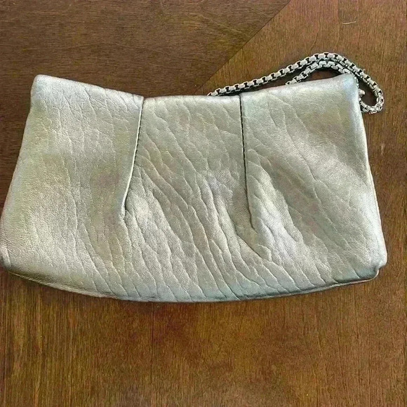 Beautiful Henri Bendel bronze wristlet with purple interior - Picture 2 of 4